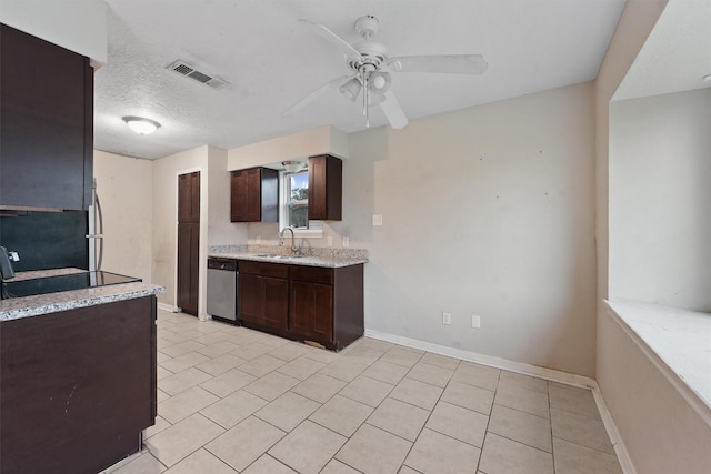 kitchen with dishwasher, sink, ceiling fan, a textured ceiling, and dark brown cabinets