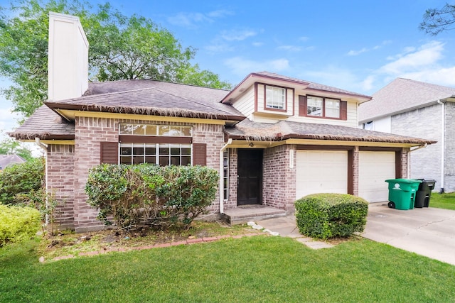 view of front of property featuring a front lawn and a garage