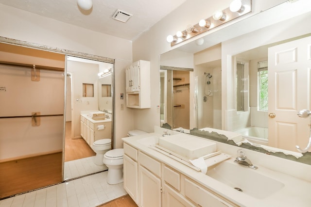 full bathroom featuring tile patterned floors, vanity, toilet, and shower with separate bathtub