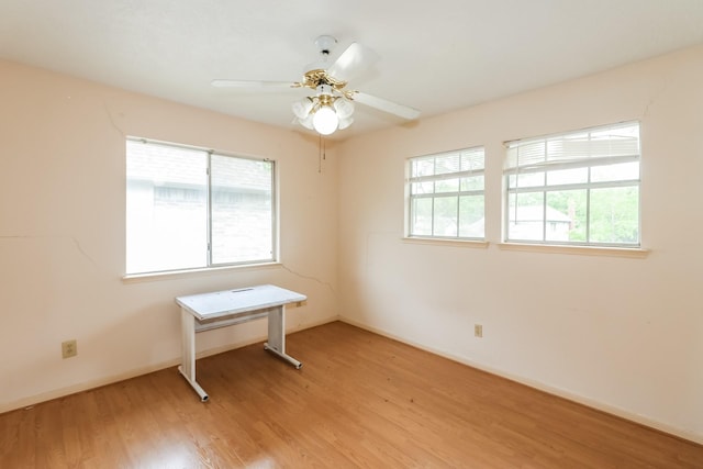 unfurnished room with ceiling fan and light hardwood / wood-style floors