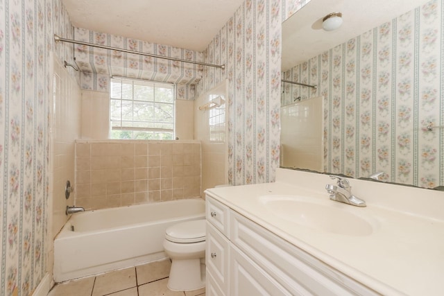 full bathroom with toilet, vanity, tile patterned floors, and tiled shower / bath