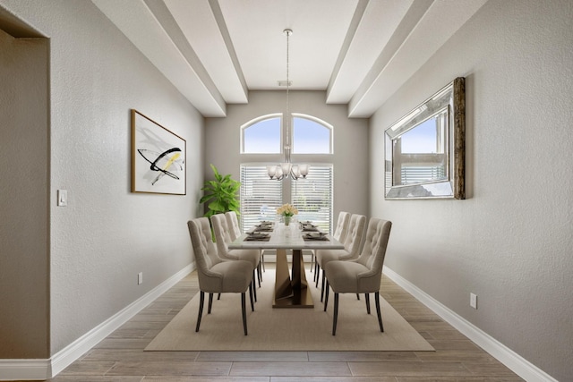 dining area with an inviting chandelier