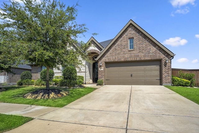 view of front facade with a garage and a front yard