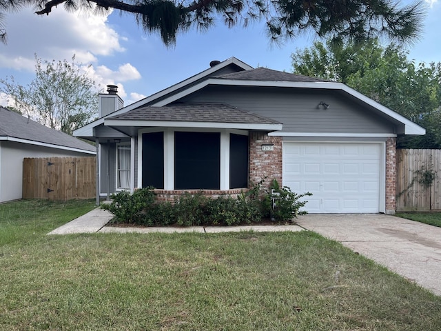 ranch-style home featuring fence, an attached garage, concrete driveway, a front lawn, and brick siding