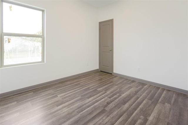 unfurnished room featuring hardwood / wood-style floors