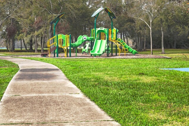 view of play area featuring a lawn