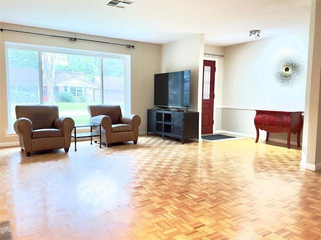 living room featuring visible vents and baseboards