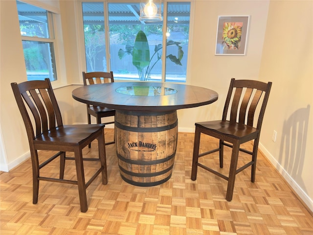 dining area featuring baseboards