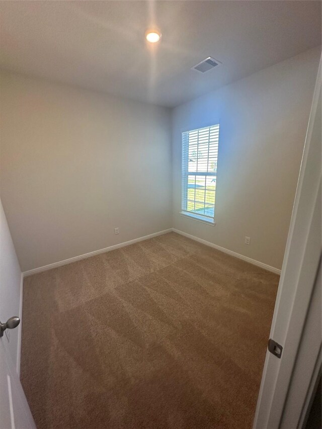 empty room with carpet flooring