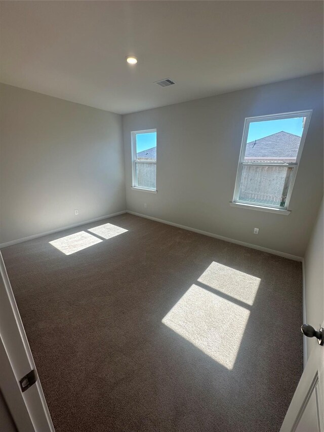 unfurnished room with carpet floors