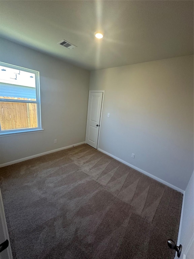 view of carpeted spare room