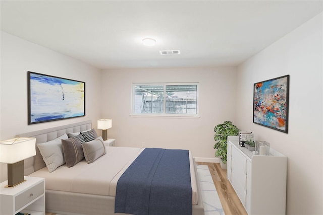 bedroom with light wood-type flooring