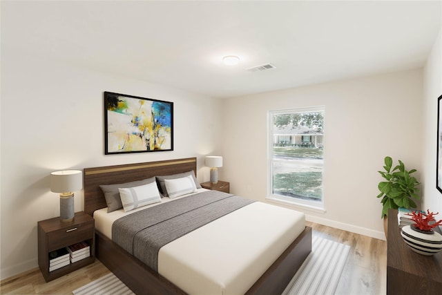 bedroom with light wood-type flooring