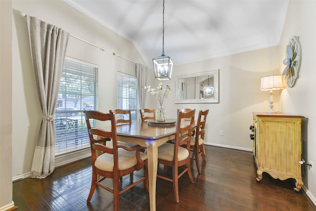 dining area featuring crown molding, dark wood-type flooring, and lofted ceiling