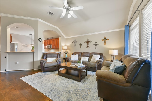 living room featuring lofted ceiling, ceiling fan, dark hardwood / wood-style floors, and ornamental molding