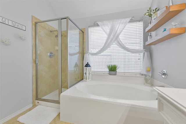 bathroom with shower with separate bathtub