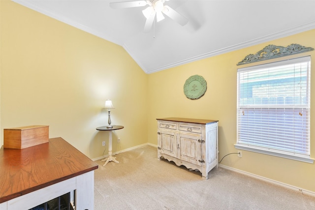 carpeted office with ceiling fan, crown molding, and vaulted ceiling