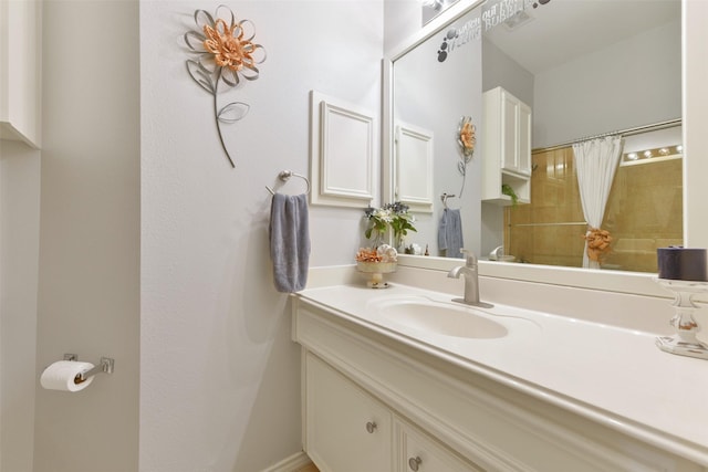 bathroom with a shower with shower curtain and vanity