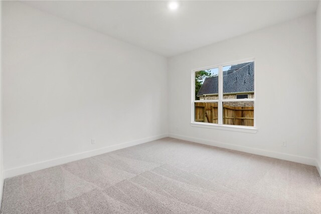 unfurnished room featuring carpet flooring