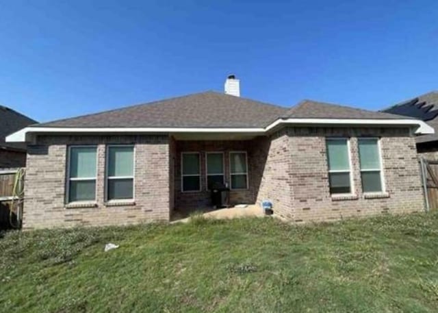 view of property exterior with a lawn