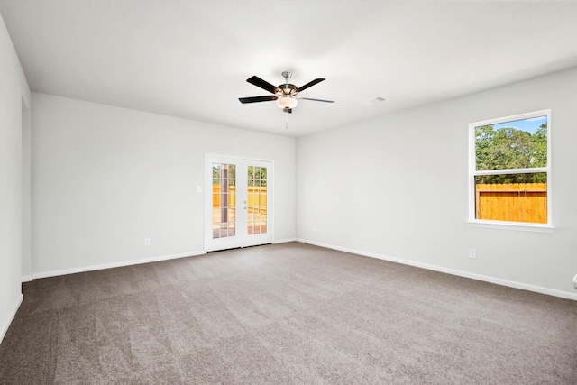 spare room with carpet and ceiling fan