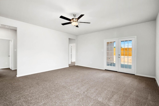 unfurnished room with ceiling fan, french doors, and dark carpet