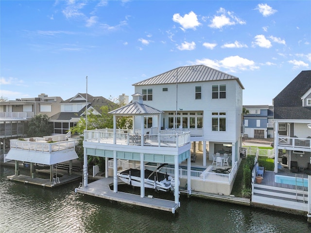 dock area with a gazebo and a water view