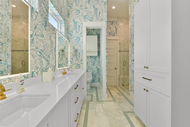 bathroom featuring toilet, an enclosed shower, and vanity