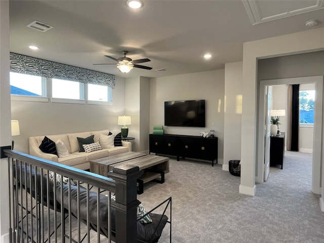 living room featuring ceiling fan and carpet