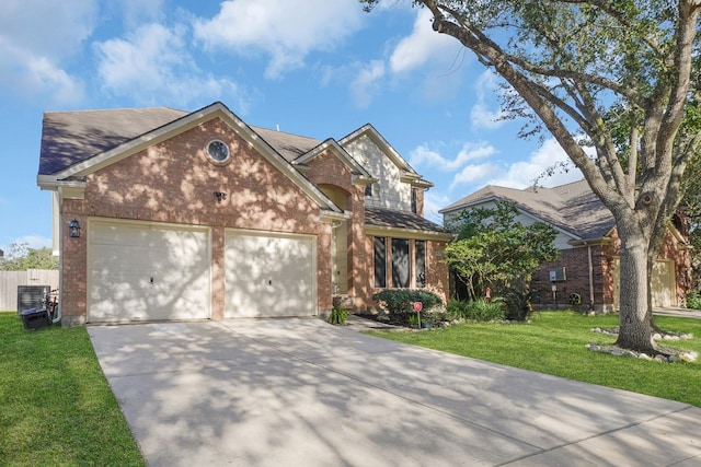 view of front of house featuring a garage and a front lawn