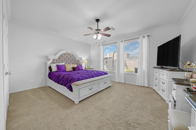 carpeted bedroom with ceiling fan and ornamental molding