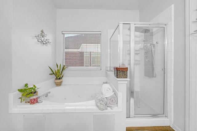 bathroom with separate shower and tub