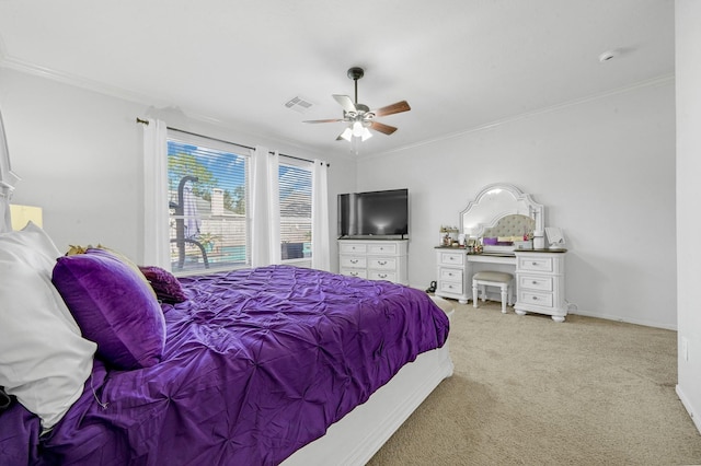 bedroom featuring light colored carpet, ceiling fan, and crown molding