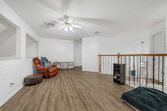 sitting room featuring hardwood / wood-style flooring and ceiling fan