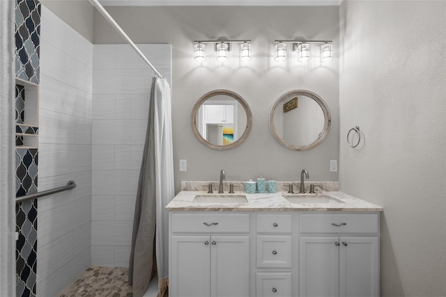 bathroom featuring vanity and a shower with shower curtain