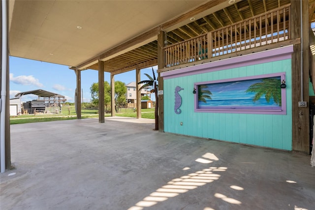 view of patio featuring a balcony