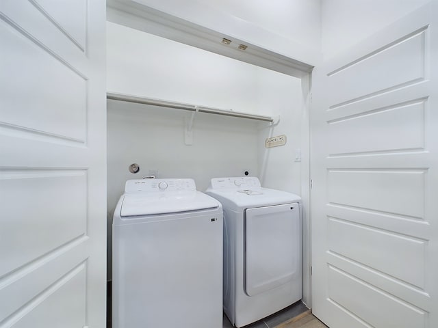 clothes washing area featuring washing machine and clothes dryer