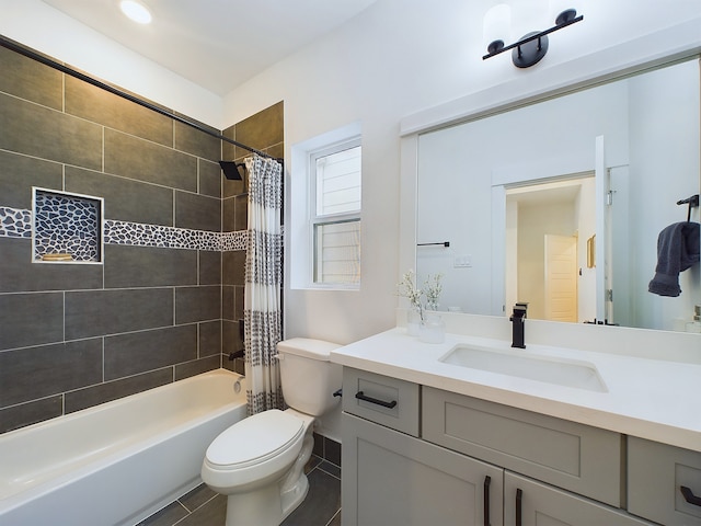 full bathroom with tile patterned floors, vanity, shower / bathtub combination with curtain, and toilet