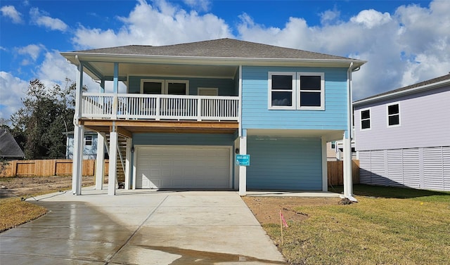 view of front of home with a front yard and a garage