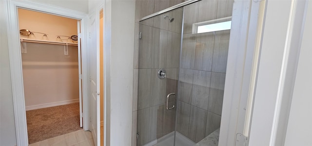 bathroom featuring tile patterned floors and an enclosed shower