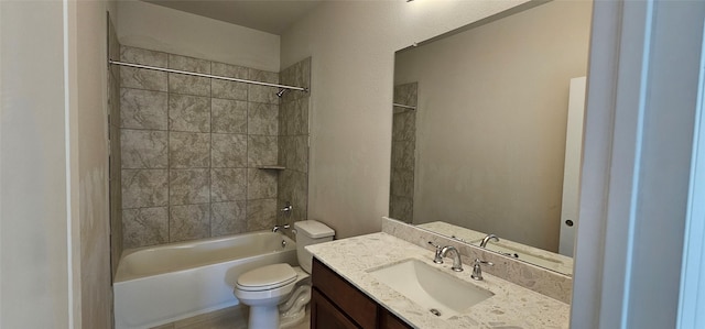 full bathroom with vanity, toilet, and tiled shower / bath