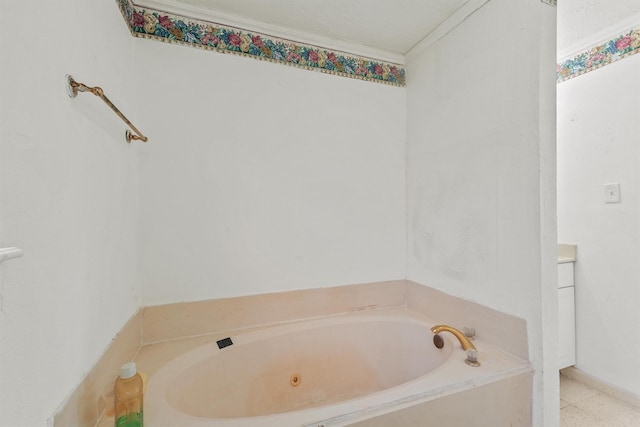 bathroom with crown molding and a bathing tub