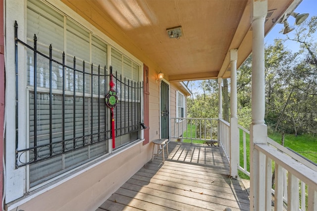 wooden terrace featuring a porch