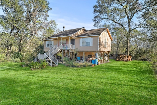 back of property featuring a lawn