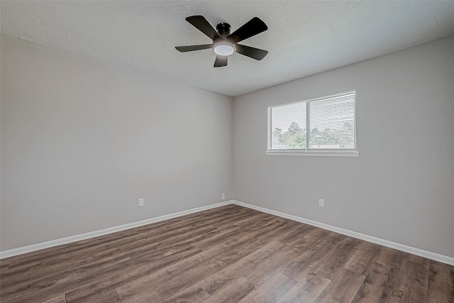 empty room featuring hardwood / wood-style floors, a textured ceiling, and ceiling fan