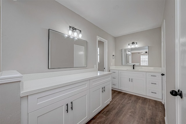 bathroom with ceiling fan, vanity, and hardwood / wood-style flooring