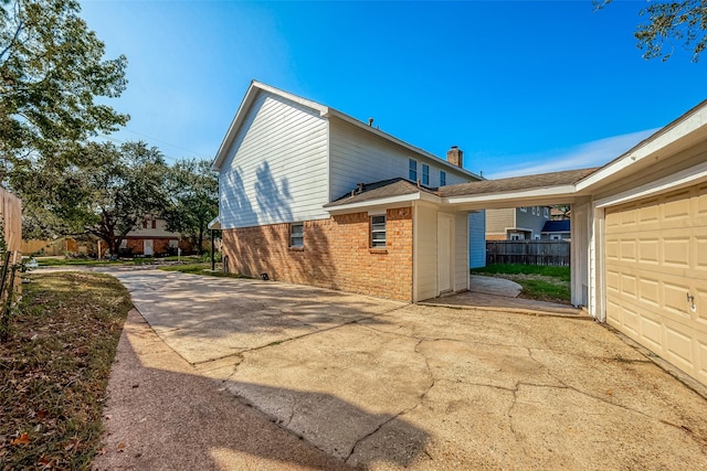 view of side of home with a garage