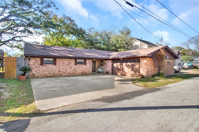 single story home with a garage