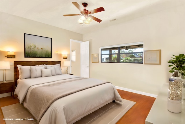 bedroom featuring hardwood / wood-style floors and ceiling fan