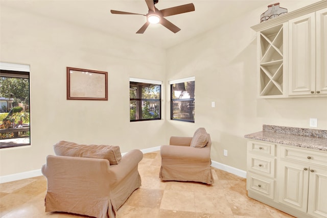 sitting room with ceiling fan